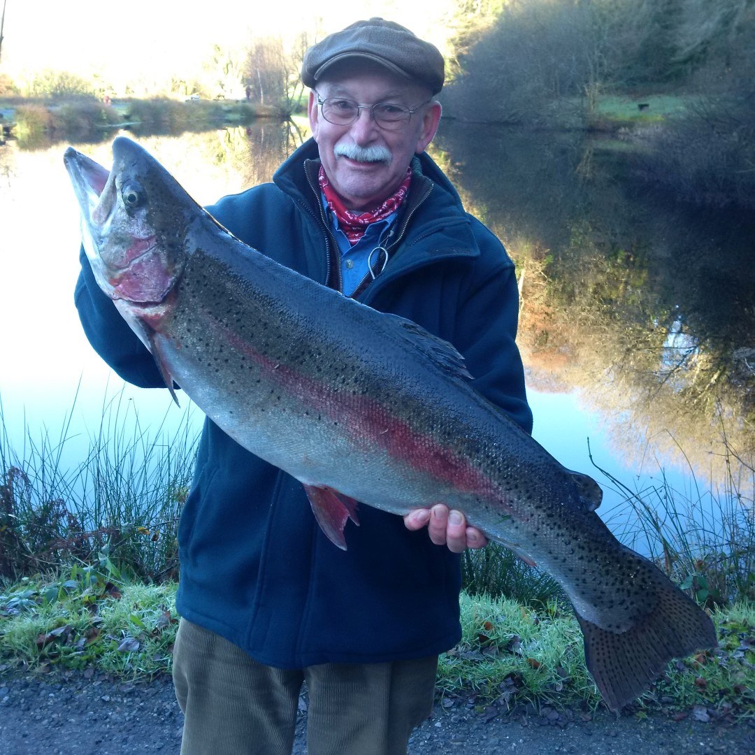 Russ Symons holding his 15lb-9oz rainbow trout