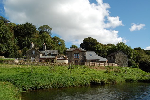 The stone cottages on the slope above a lake